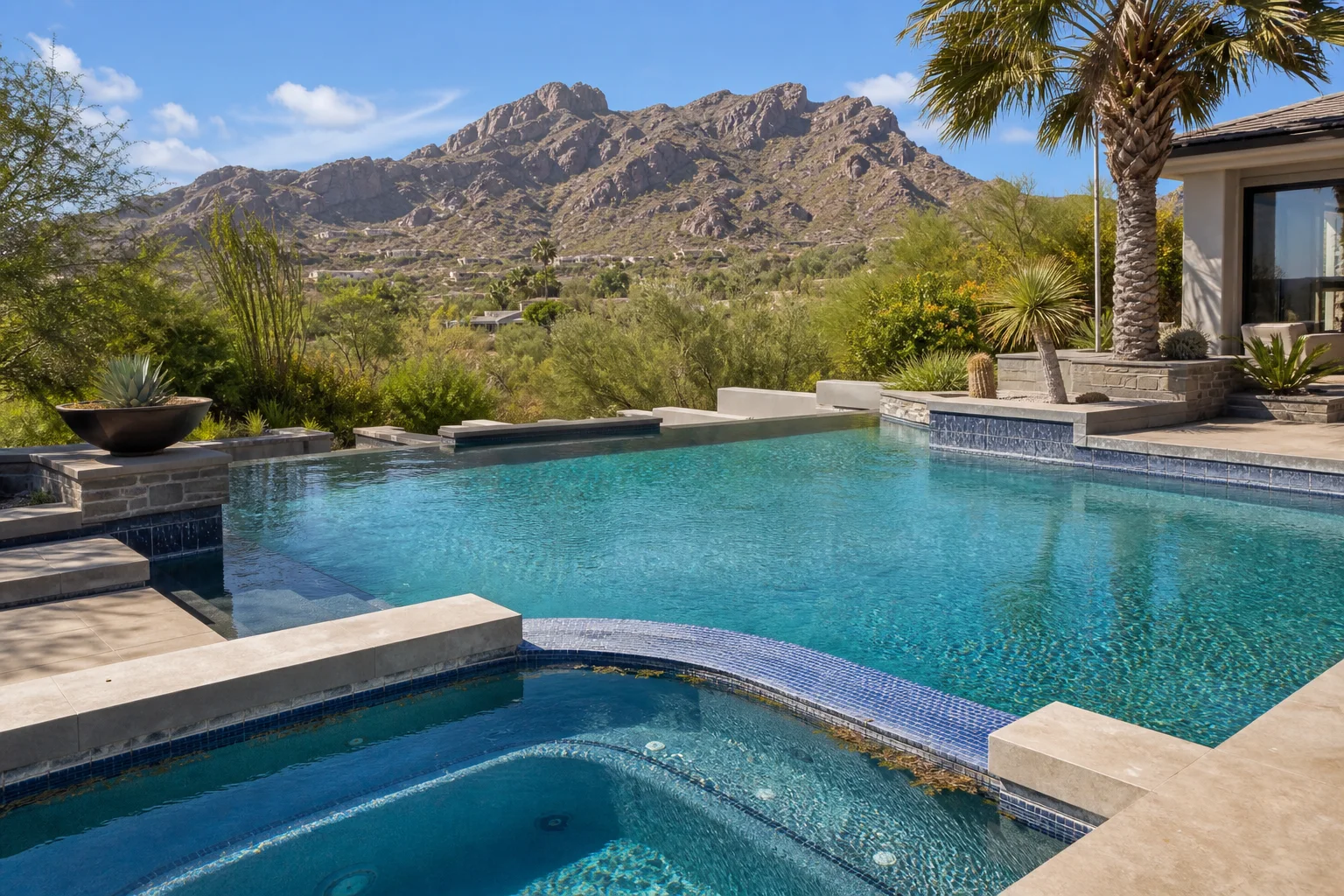 Paradise Valley pool and spa showing sun exposure, windblown leaves, and mineral buildup at the waterline